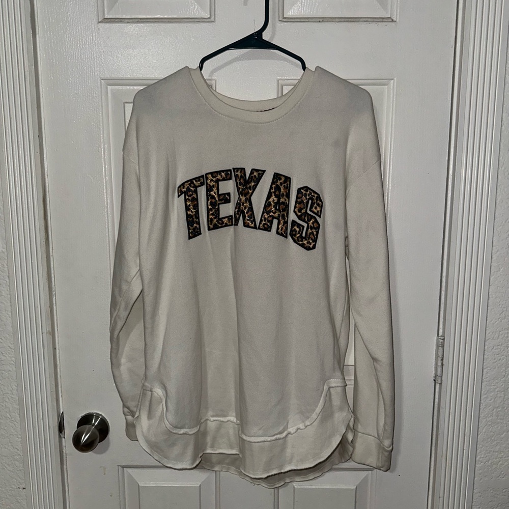 Crew neck sweat shirt with “TEXAS” in cheetah print